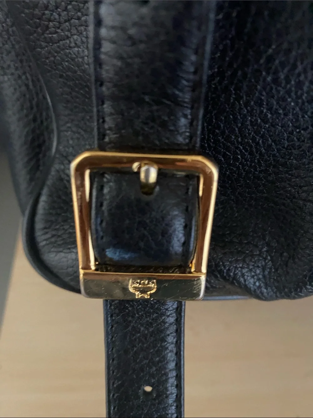 MCM Black Pebbled Leather Backpack with Gold Emblem Hardwarer
